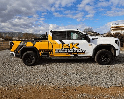 J & K Excavating branded work truck on a Western Colorado job site